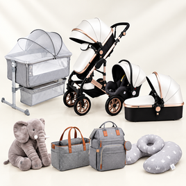 A baby travel and feeding set displayed on a light cream background, including a stroller, bassinet, car seat, diaper bag, backpack, plush elephant toy, and nursing pillow. The products are primarily white and gray with rose gold metallic accents.